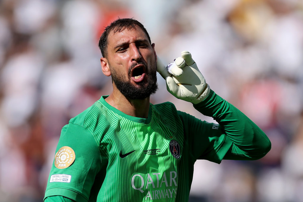 Gianluigi Donnarumma with his finger on his ear during Paris Saint-Germain v Real Madrid .
