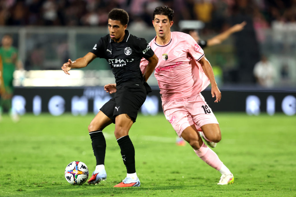 Rico Lewis passing the ball during Palermo v Manchester City