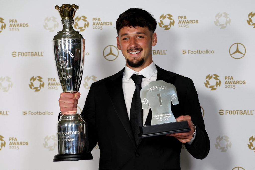 Manchester City's English goalkeeper James Trafford poses with the Men's PFA Players' Championship Player of the Year award backstage during the 2024-2025 Professional Footballers' Association (PFA) awards, at the Opera House in Manchester, northern England, on August 19, 2025.