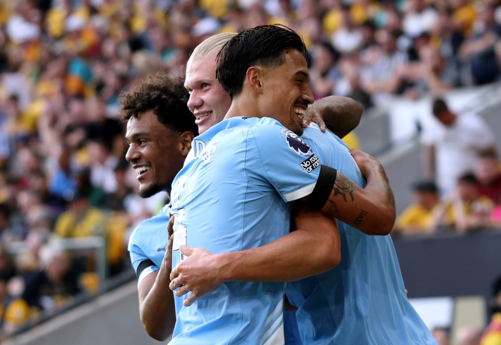 Tijjani Reijnders hugs Erling Haaland during Wolverhampton Wanderers v Manchester City.