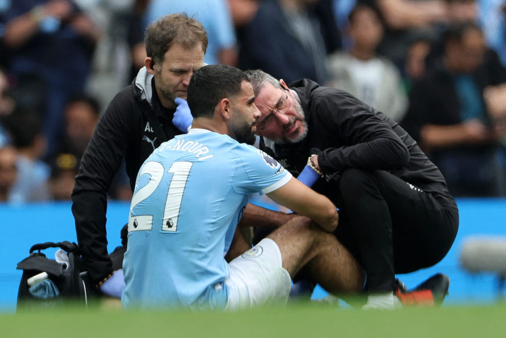 Rayan Ait-Nouri down injured during a Premier League clash between Manchester City and Tottenham