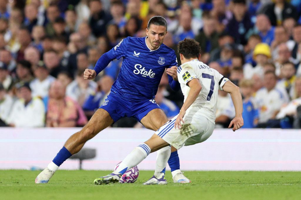 Jack Grealish trying to dribble past Leeds United's Dan James v Everton