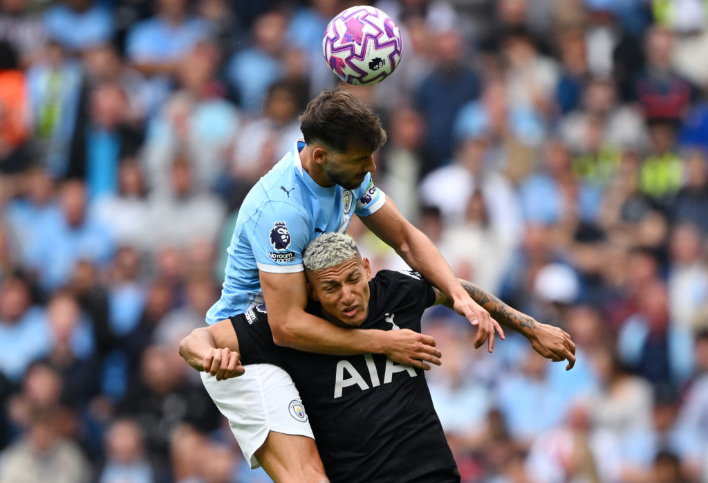 Ruben Dias contesting an aerial duel with Richarlison during Manchester City v Tottenham Hotspur