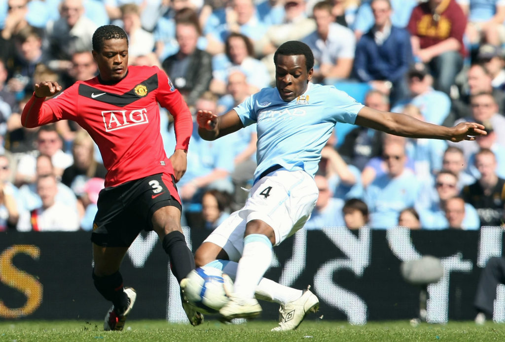 Patrice Evra of Manchester United clashes with Nedum Onuoha of Manchester City during the Barclays Premier League match between Manchester City and Manchester United at City of Manchester Stadium on April 17 2010
