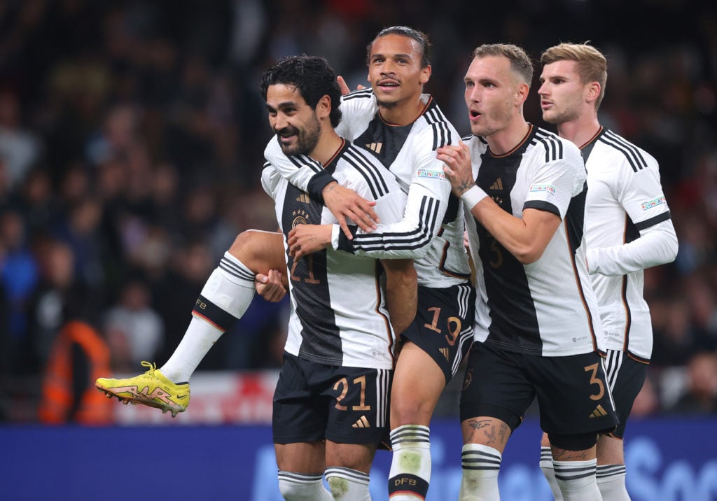 Ilkay Gundogan of Germany celebrates with Leroy Sane and David Raum after scoring the opening goal during the UEFA Nations League League A Group 3 match between England and Germany at Wembley Stadium on September 26, 2022 in London, England.