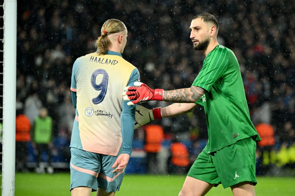 Erling Haaland of Manchester City and Gianluigi Donnarumma of PSG react during the UEFA Champions League 2024/25 League Phase MD7 match between Paris Saint-Germain and Manchester City at Parc des Princes on January 22, 2025