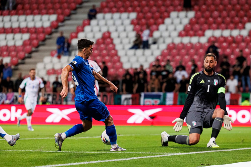 Dan Biton and Gianluigi Donnarumma in action during Israel v Italy