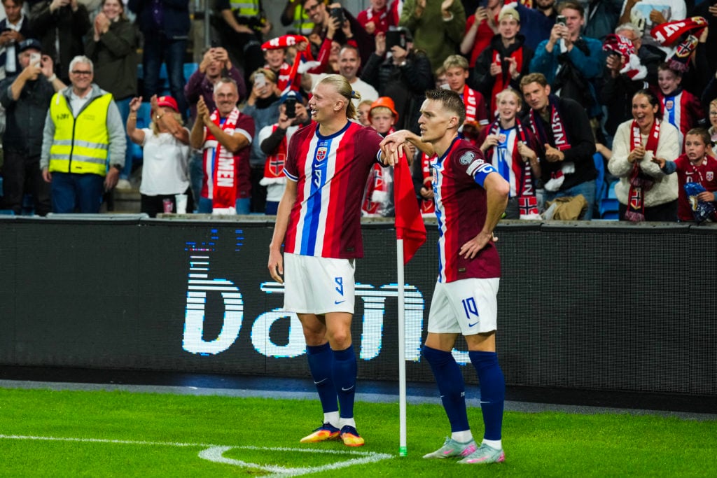 Norway's forward Erling Braut Haaland (L) and celebrates the 3-0 goal with Norway's midfielder Martin Ødegaard during the 2026 World Cup qualifiers Europe zone group I football match between Norway and Moldova