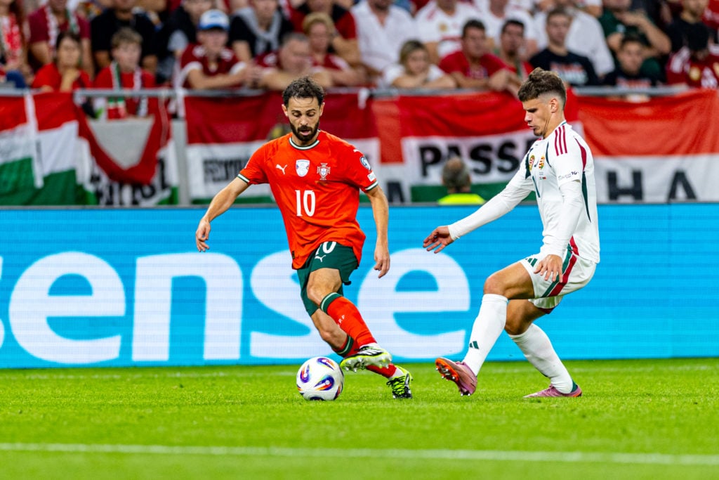 Bernardo Silva of Portugal in action against Milos Kerkez of Hungary during the FIFA World Cup 2026 qualifier match between Hungary and Portugal at Puskas Arena on September 09, 2025 in Budapest, Hungary.