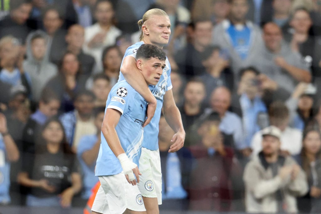 Phil Foden and Erling Haaland embrace each other during Manchester City vs Napoli.