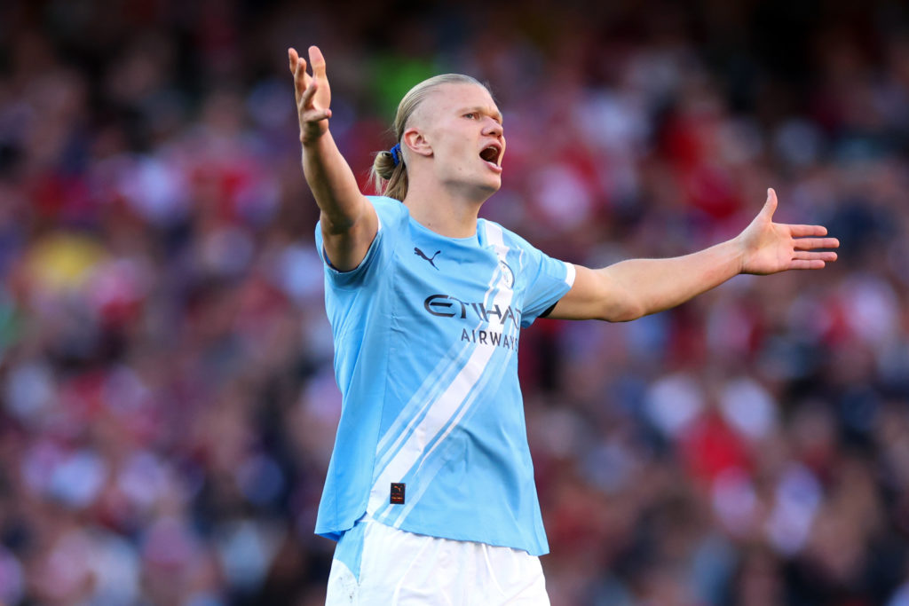 Erling Haaland with his arms out wide during Arsenal v Manchester City.