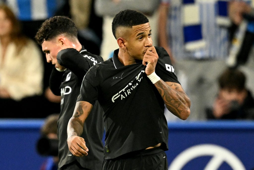Savinho kisses the Man City badge.