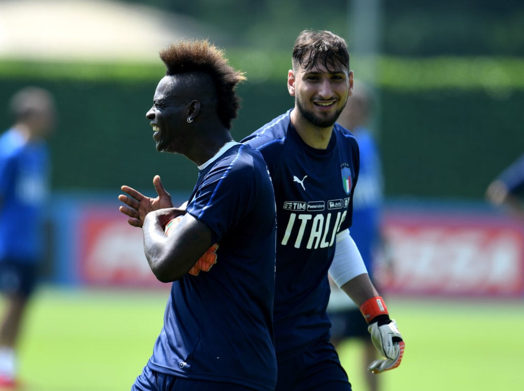 Mario Balotelli (L) and Gianluigi Donnarumma of Italy joked during a Italy training session at Centro Tecnico Federale di Coverciano on May 25, 2018