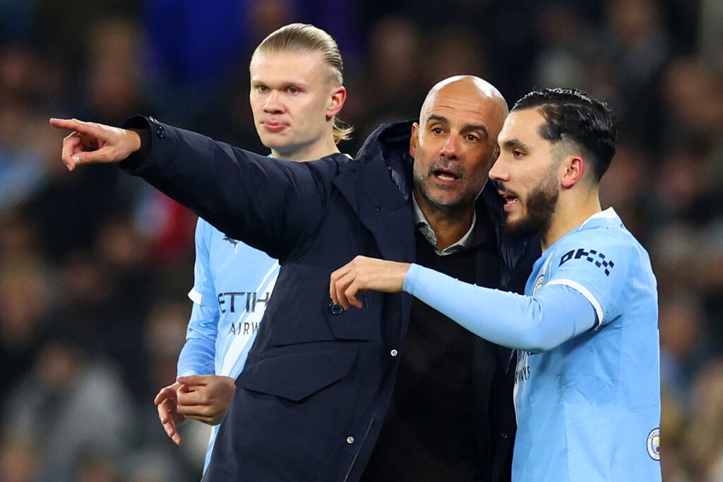 Pep Guardiola giving instructions to Rayan Cherki.