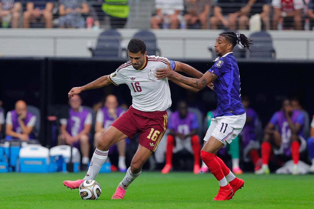 Rodri playing for Spain against France.