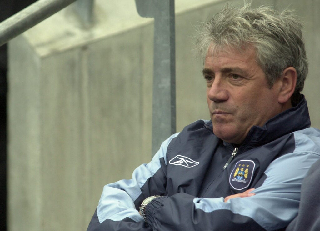 Kevin Keegan looks on.